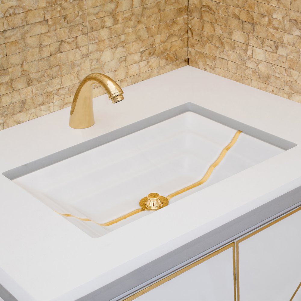 white glass with gold accent sink